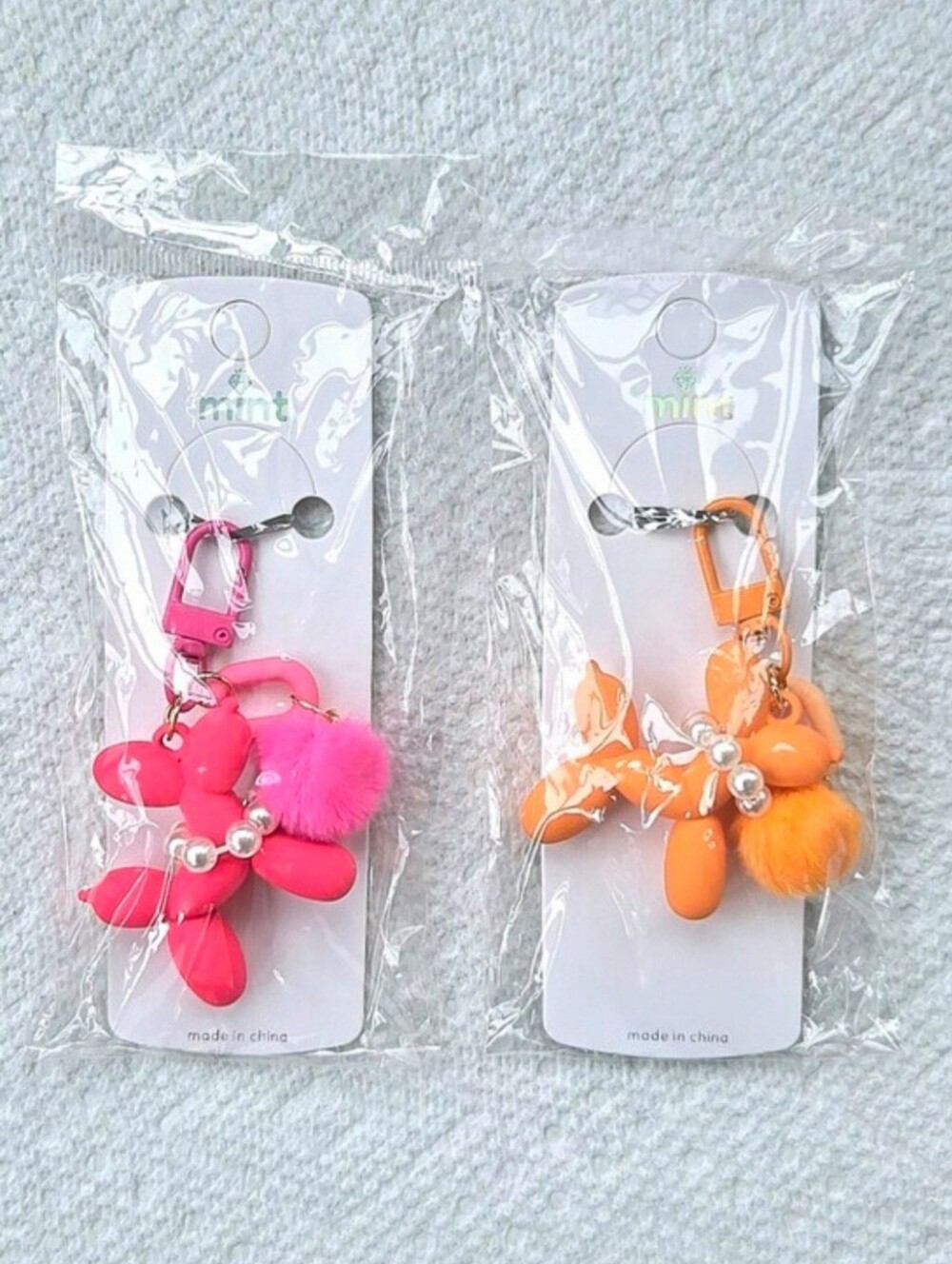 Balloon Dog Keychain/Bag Charms with pom pom detail by Mint - Set Of 2
